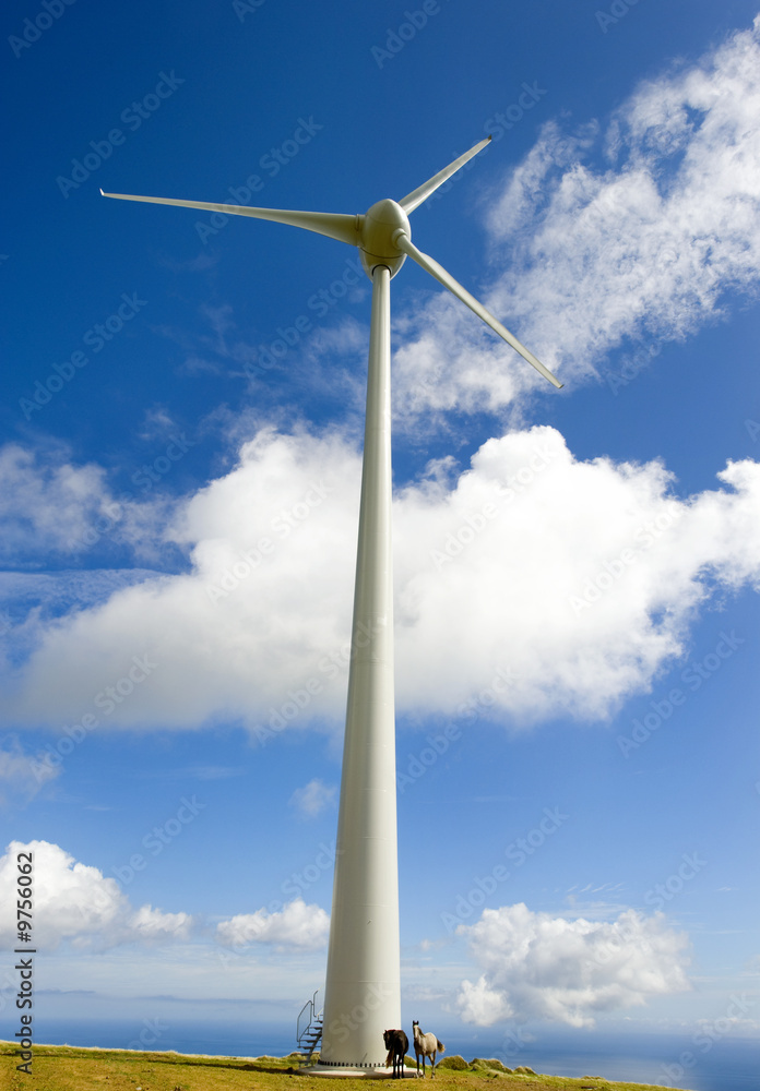 A powerful windmill generating clean renewable energy. A powerful windmill generating clean renewable energy.