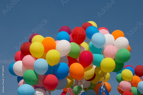 Countless colorful balloons flying in deep blue sky