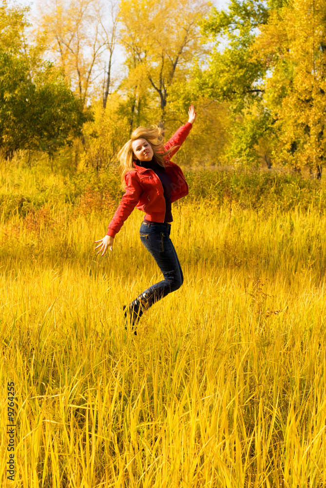 happy beautiful girl jumping in the park happy beautiful girl jumping in the park