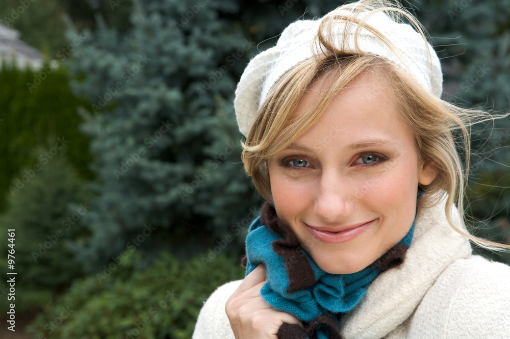 Pretty Blond wearing a scarf and white coat and hat