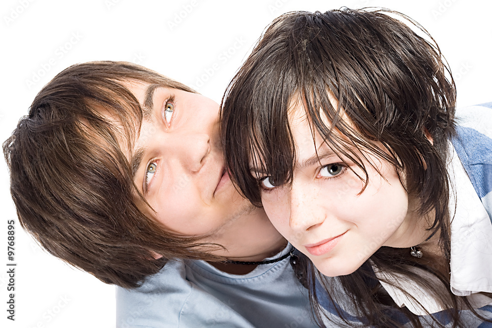 Portrait of the young couple. Isolated on white background Portrait of the young couple. Isolated on white background