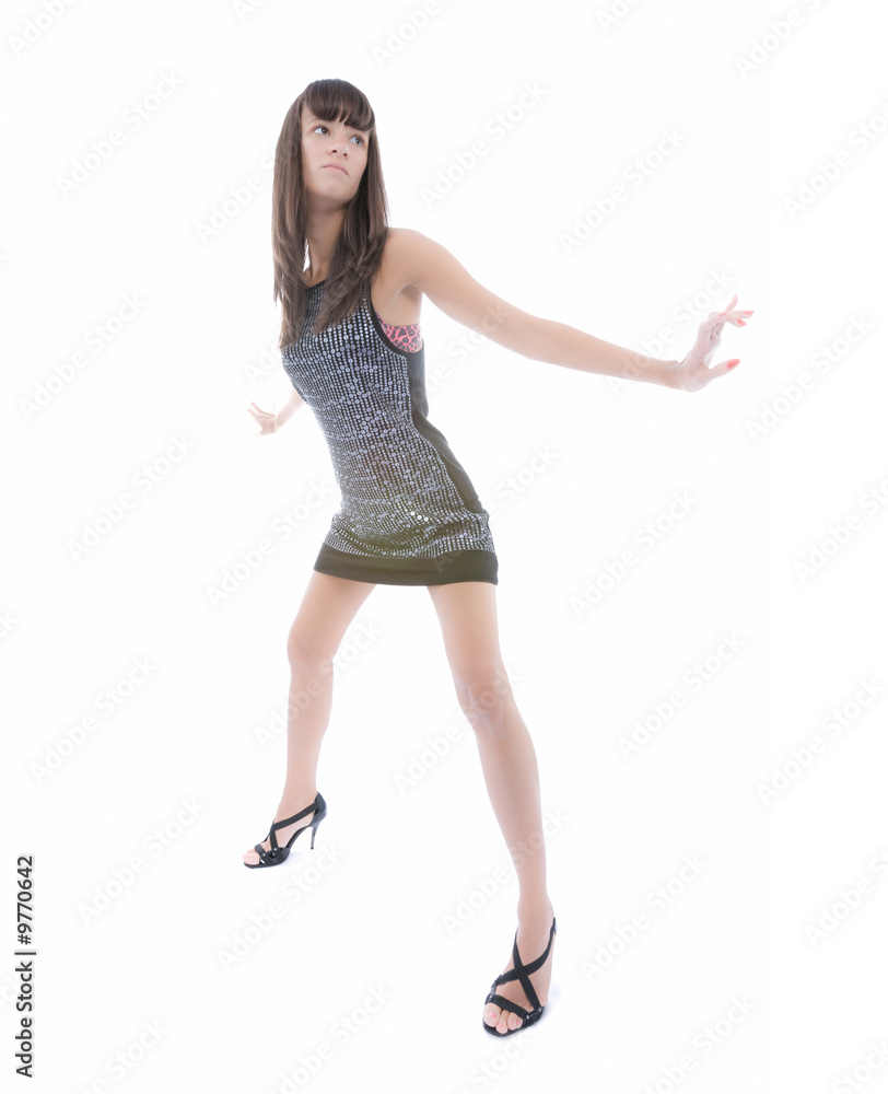 Beautiful woman in short dress poses over white Beautiful woman in short dress poses over white