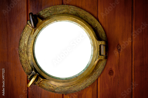 Close-up of a closed boat porthole with wihite background photo