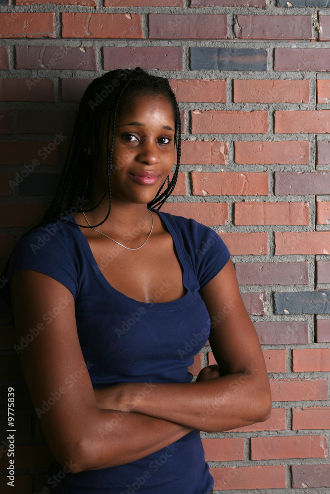 natural light portriat of black teenage girl with arms crossed natural light portriat of black teenage girl with arms crossed