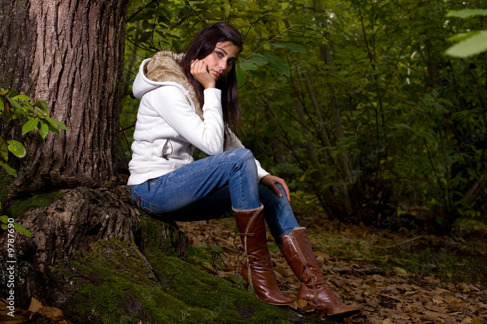 young woman on autumn forest under chestnut tree young woman on autumn forest under chestnut tree