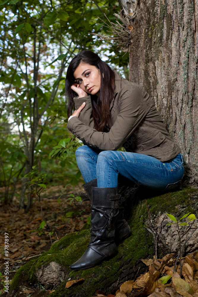 young woman on autumn forest under chestnut tree young woman on autumn forest under chestnut tree