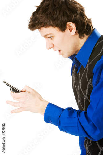 Surprised man holding a cellphone and reading sms