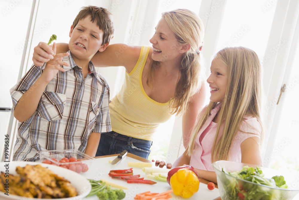 Mother And Children Prepare A meal,mealtime Together