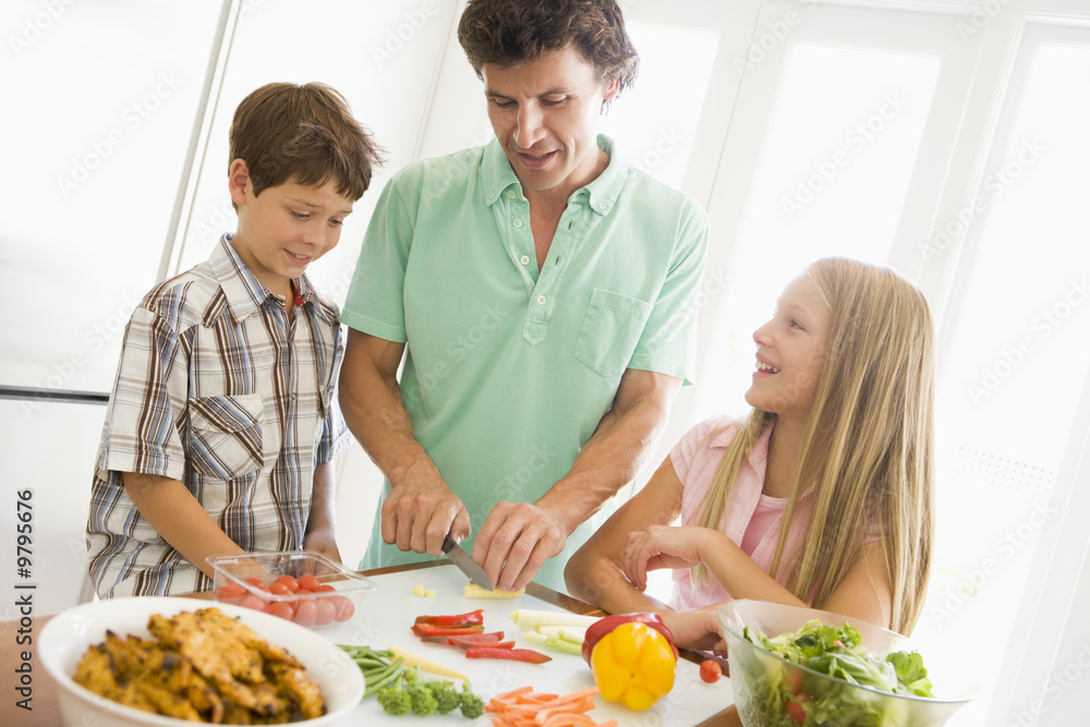 Father And Children Prepare A meal,mealtime Together