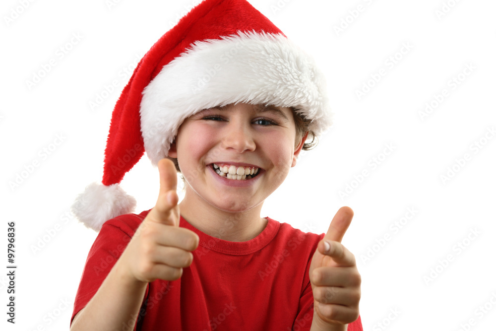 Christmas time - boy with Santa's hat isolated on white Christmas time - boy with Santa's hat isolated on white