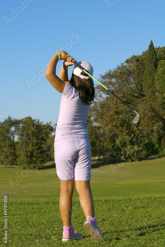 young golf player trying a shot