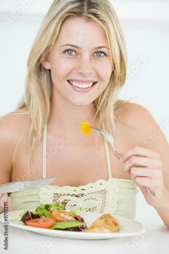 Young Woman Enjoying Healthy meal,mealtime photo