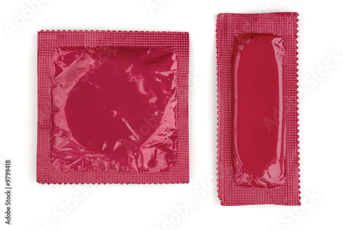 Two pink condoms in square and rectangle packaging on white