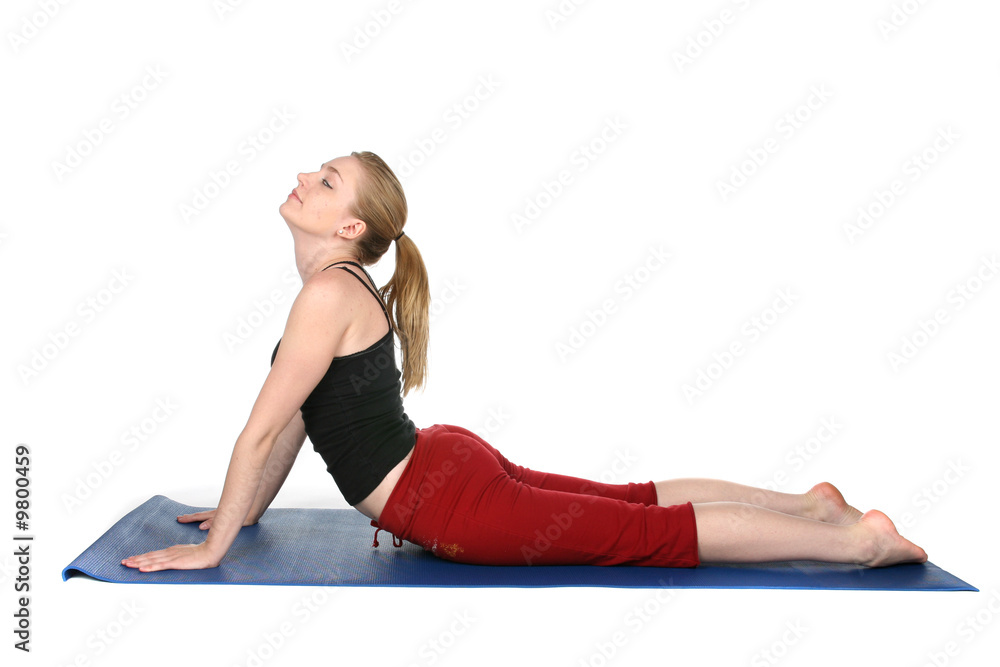 young woman demonstrating yoga cobra pose young woman demonstrating yoga cobra pose