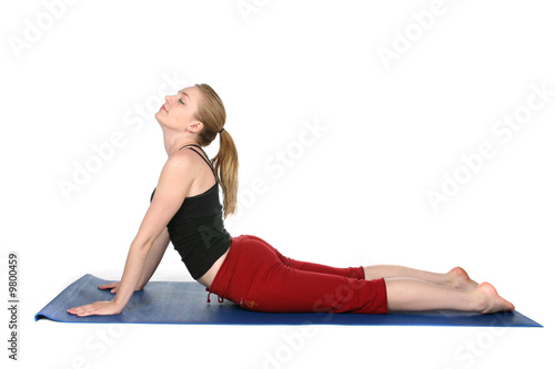 young woman demonstrating yoga cobra pose