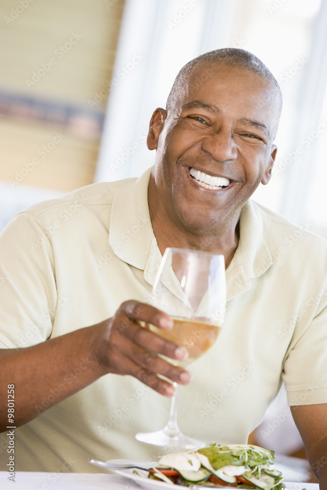 Man Enjoying meal,mealtime With A Glass Of Wine Man Enjoying meal,mealtime With A Glass Of Wine