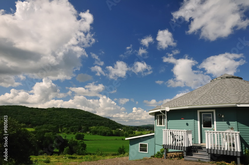 A sixteen-sided house overlooking a green river valley