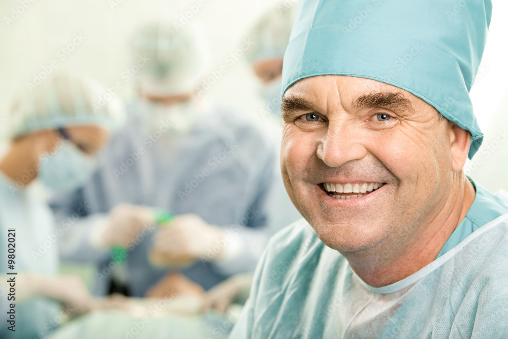 Portrait of senior doctor smiling