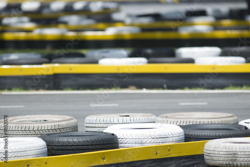 Фотография Old tyres used as bumper zone at a go-kart race circuit.