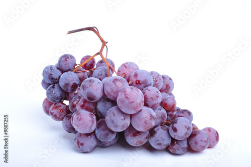Cluster of grapes on white ...