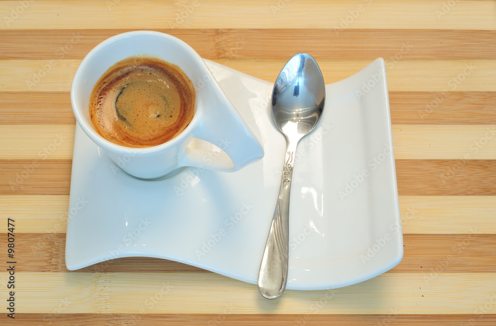 Obraz premium Close up, white cup of coffee and wooden background