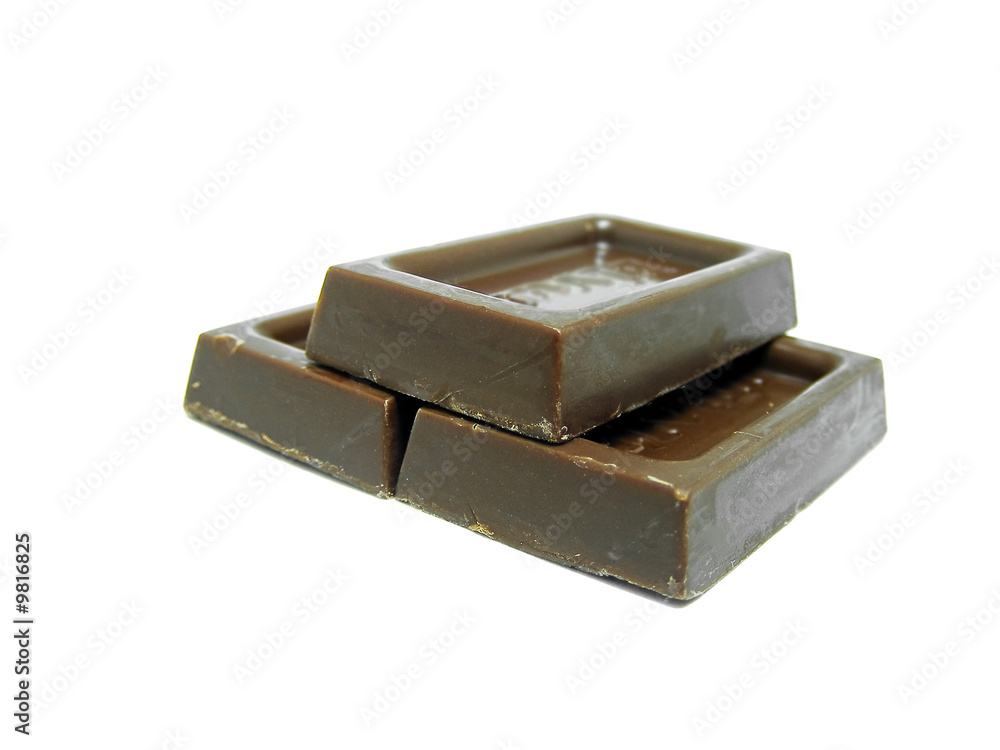Pieces of chocolate on pile isolated on white background Pieces of chocolate on pile isolated on white background