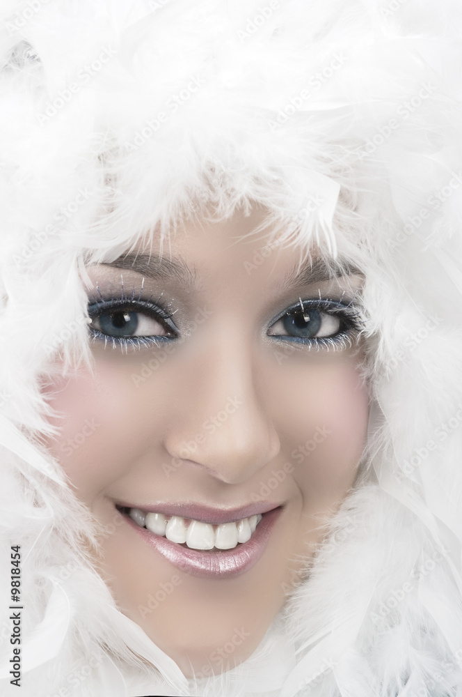 Girl with beautiful make up and white feathers