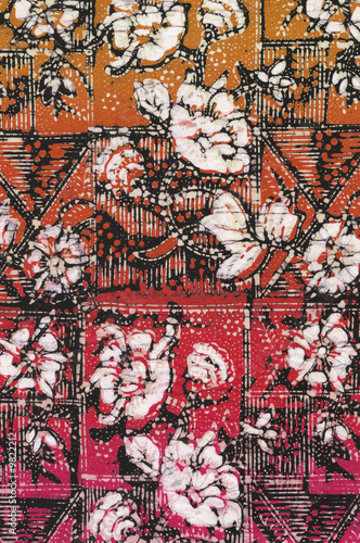 Red batik sarong with white floral motif