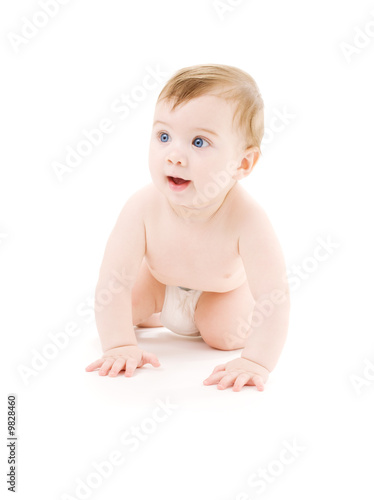 bright picture of crawling baby boy in diaper © Syda Productions