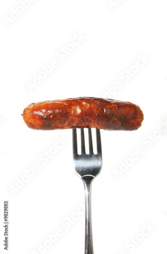 Freshly cooked sausage on a fork
