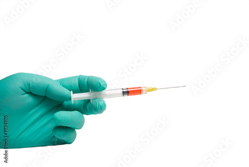 A healthcare worker holding a medical syringe.