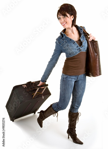 Smiling Young Lady Pulling her Luggage