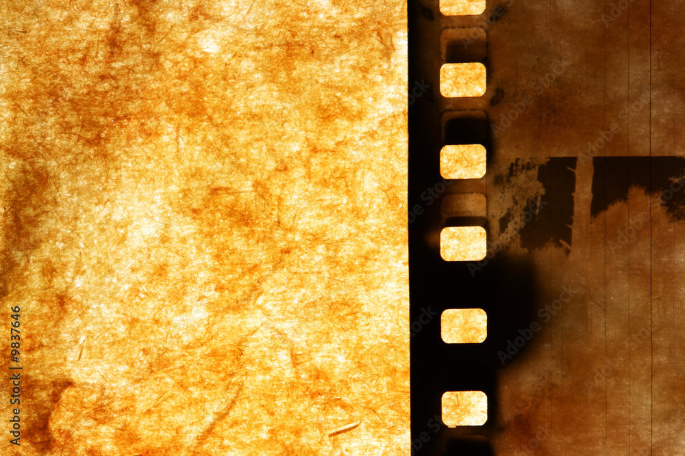 Obraz premium Old film strip over grunge paper background