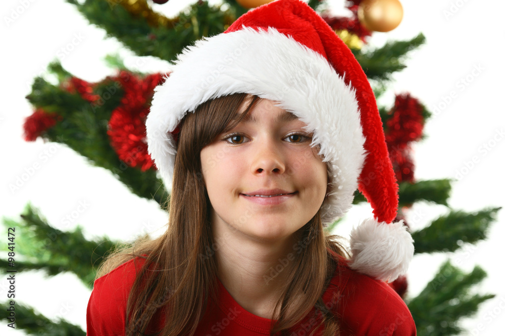 Christmas time - girl with Santa's hat isolated on white Christmas time - girl with Santa's hat isolated on white