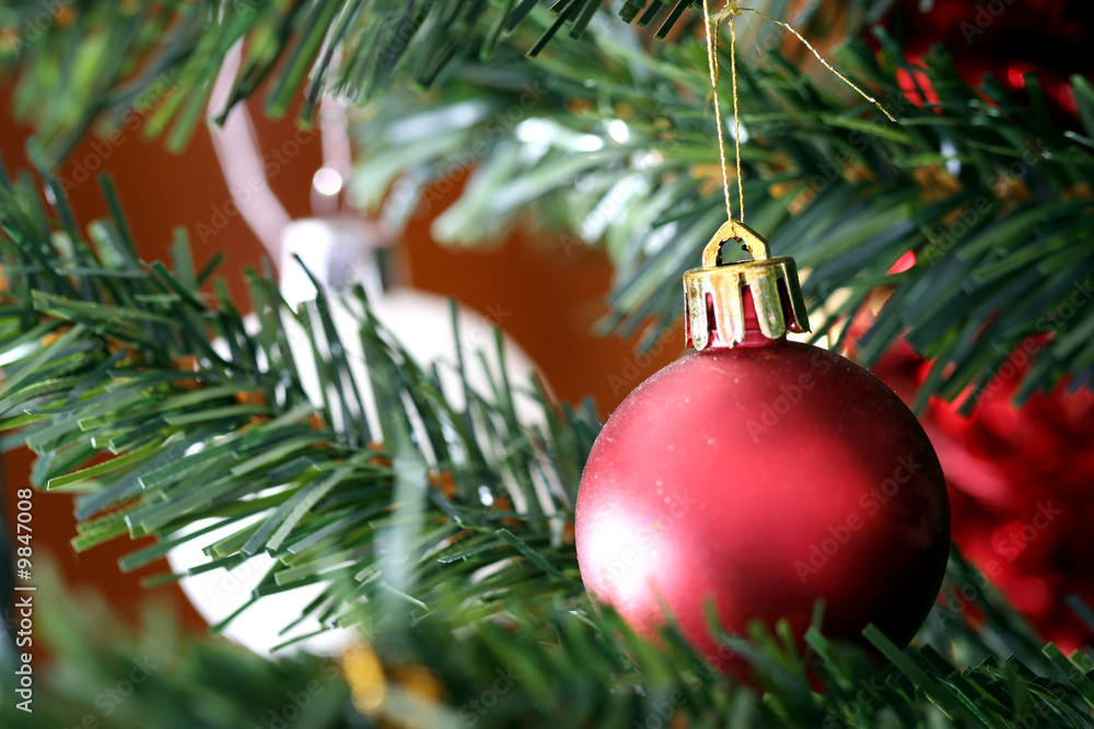 Fototapeta premium Close up of Christmas ornaments on tree.