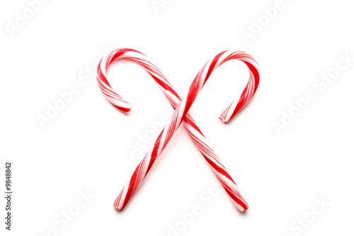 Two red and white Christmas candy canes, isolated on white