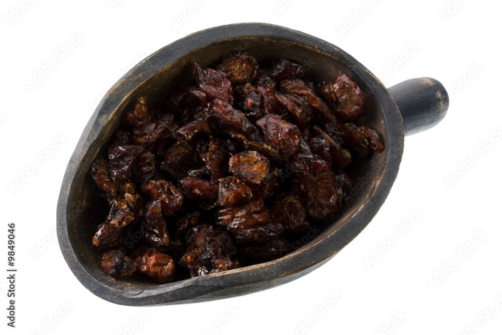 dried cranberries on a primitive, wooden, scoop, isolated dried cranberries on a primitive, wooden, scoop, isolated