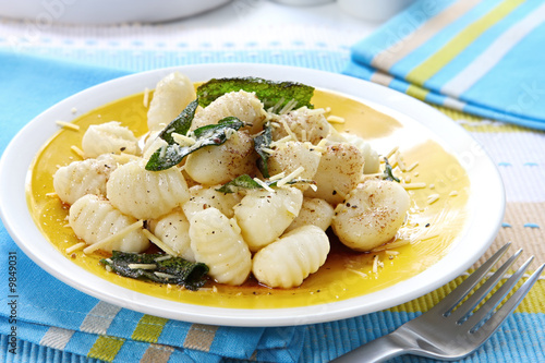 Potato gnocchi with burnt sage butter and parmesan cheese.