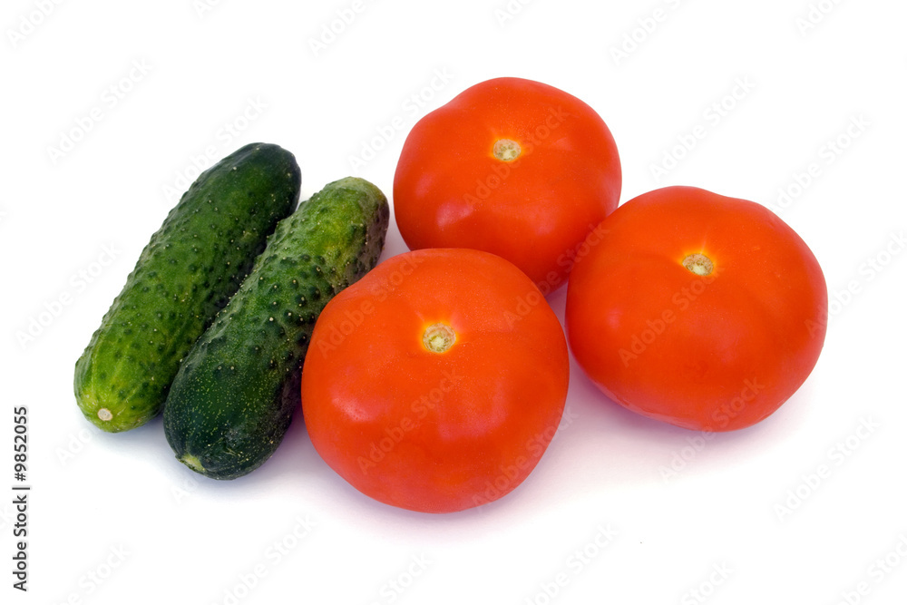 Cucumbers and tomato, isolated on white background Cucumbers and tomato, isolated on white background