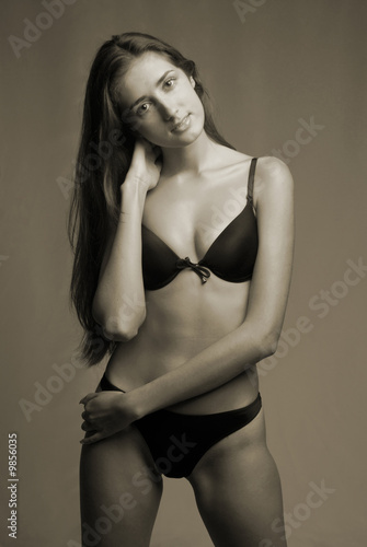 woman in underwear on dark background