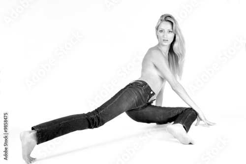Studio portrait of a blond woman in only jeans