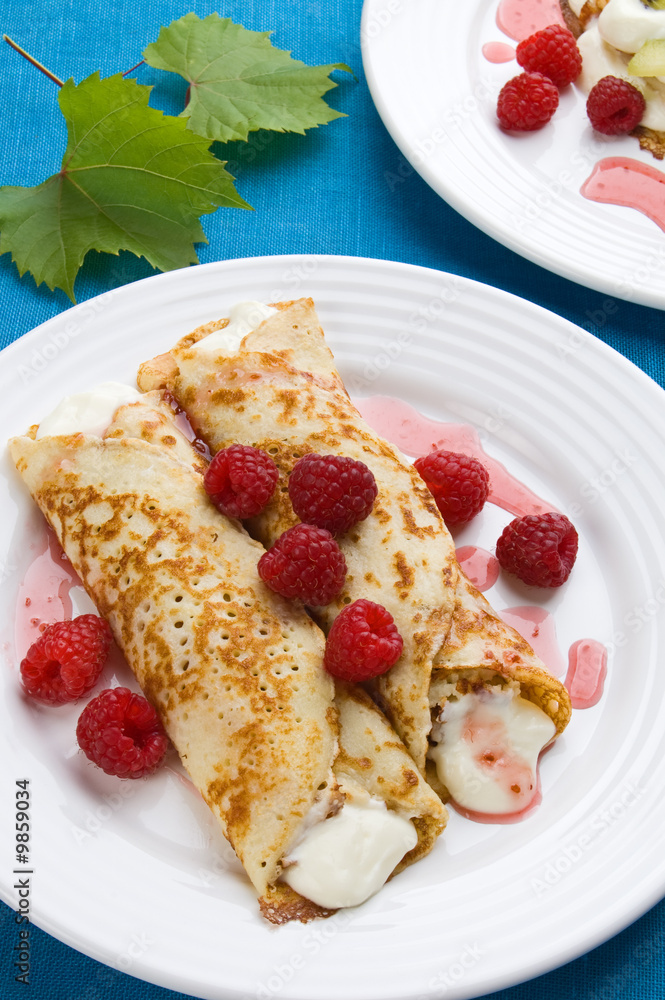 Pancakes with cream and raspberries Pancakes with cream and raspberries