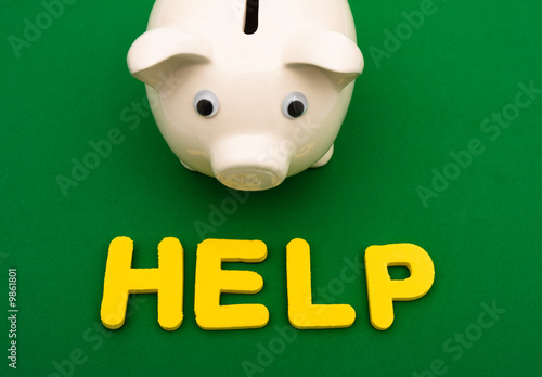 Piggy bank with the word help , financial help