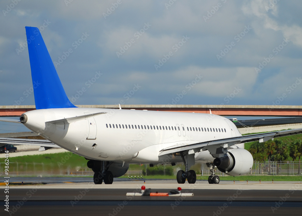 Rear view image of departing passenger jet Rear view image of departing passenger jet