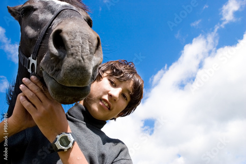 Young cowboy and his favorite horse Jezgeeck, Kazakhstan