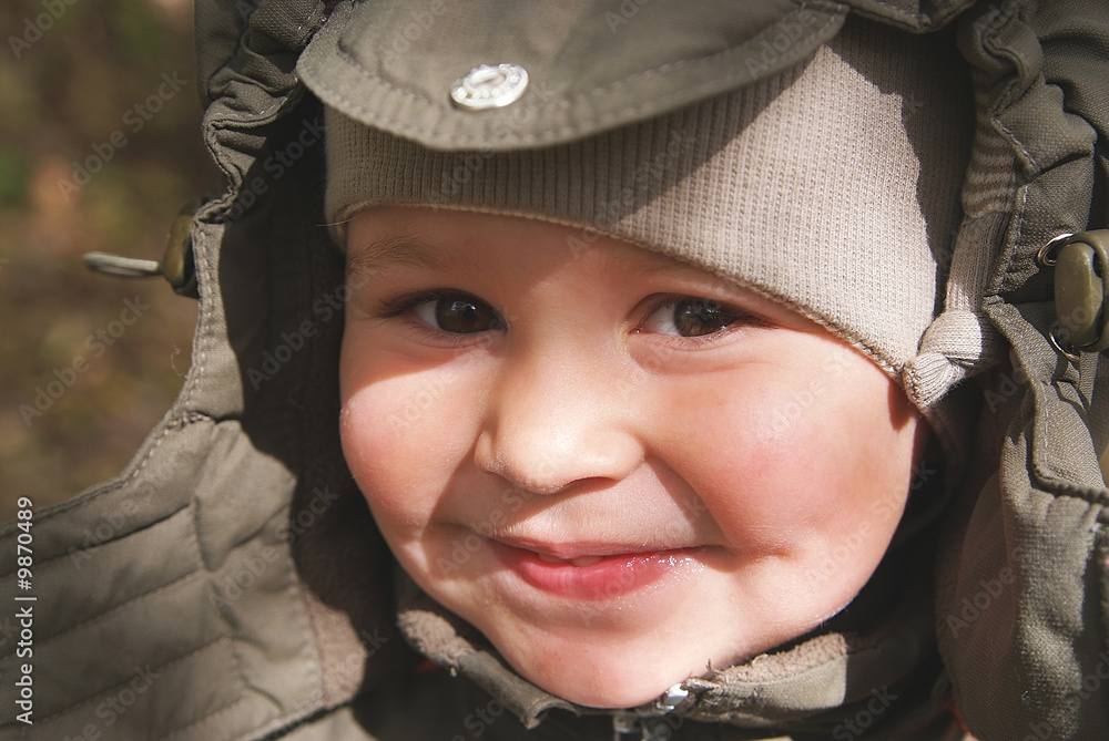 Cute, smiling little boy in autumn clothes Cute, smiling little boy in autumn clothes