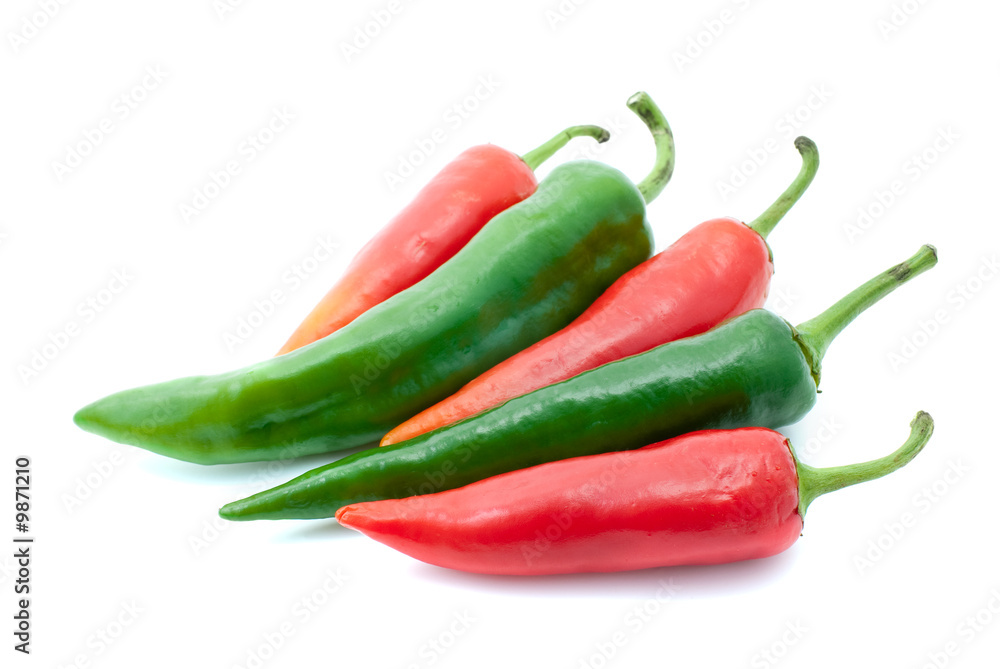 Few red and green chili peppers isolated on the white background
