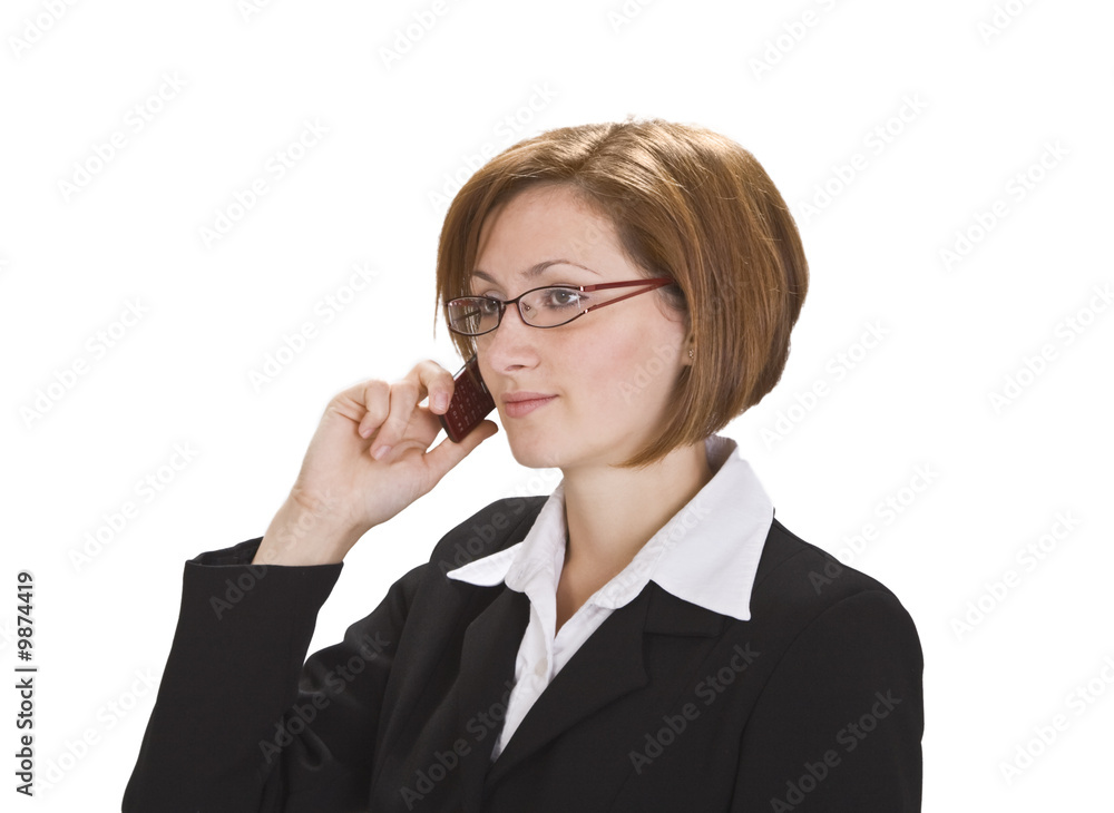 Serious businesswoman with glasses using a mobile phone. Serious businesswoman with glasses using a mobile phone.