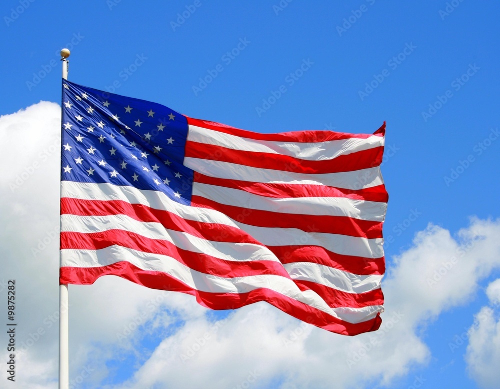 US Flag Against a Vibrant Blue Sky