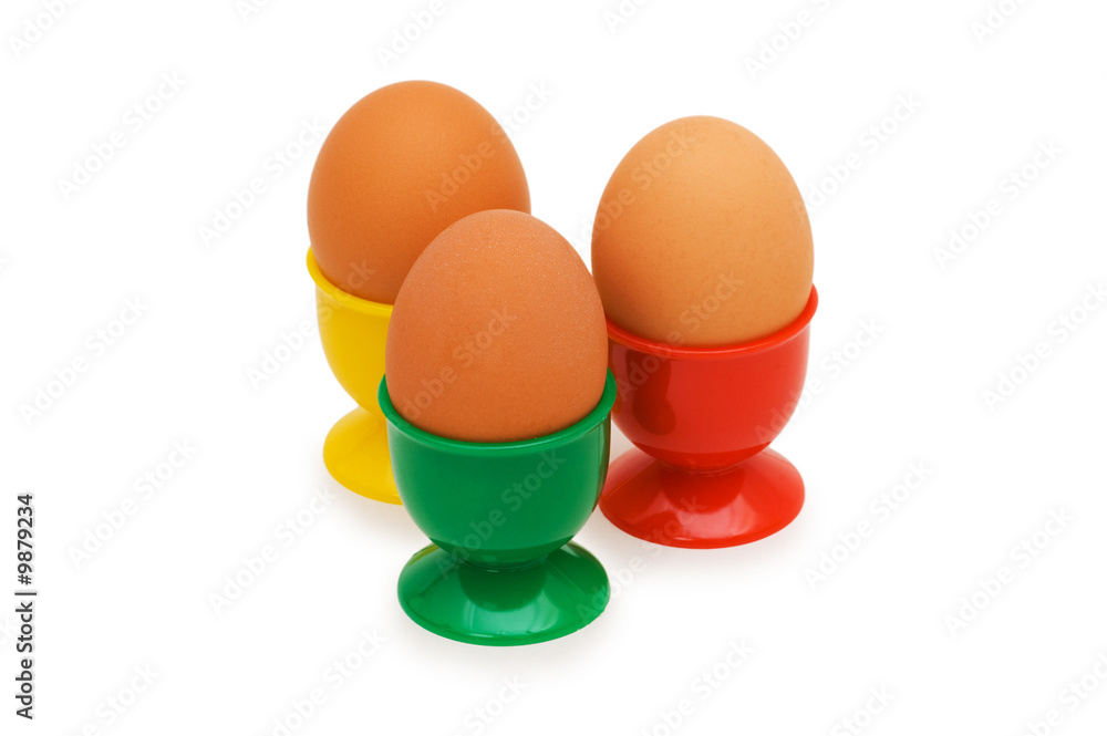 Brown eggs in holder isolated on white Brown eggs in holder isolated on white